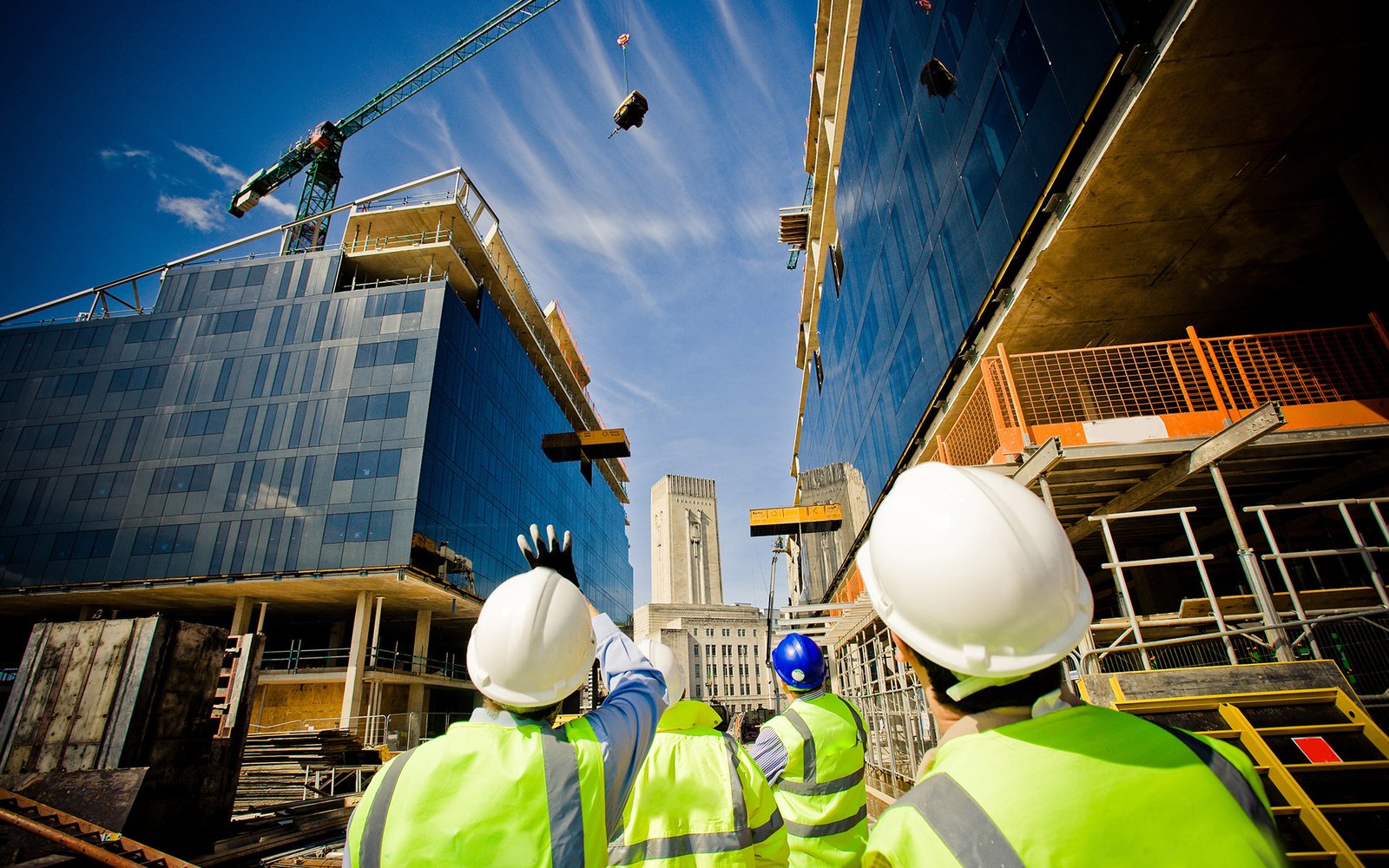 Construction site with yellow hard hat and gloves